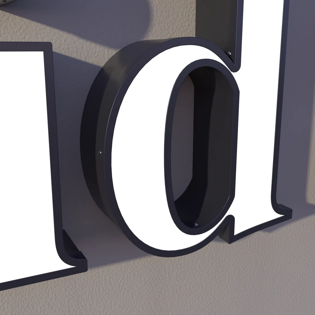 Close-up of a front-lit letter d with a white face and black stainless return