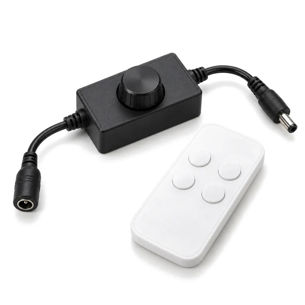 Small black inline 12 V LED dimmer with a round knob and barrel-connector leads, next to a white RF remote, on white